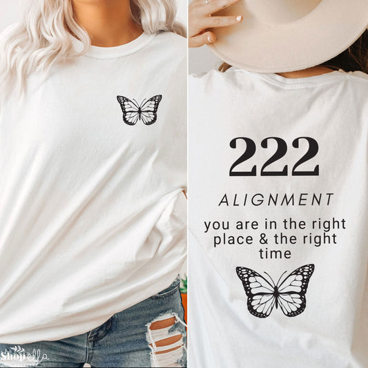 front of shirt has black butterfly in left front corner pocket and back says 222 alignement you are in the right place and the right time with a large butterfly under the text