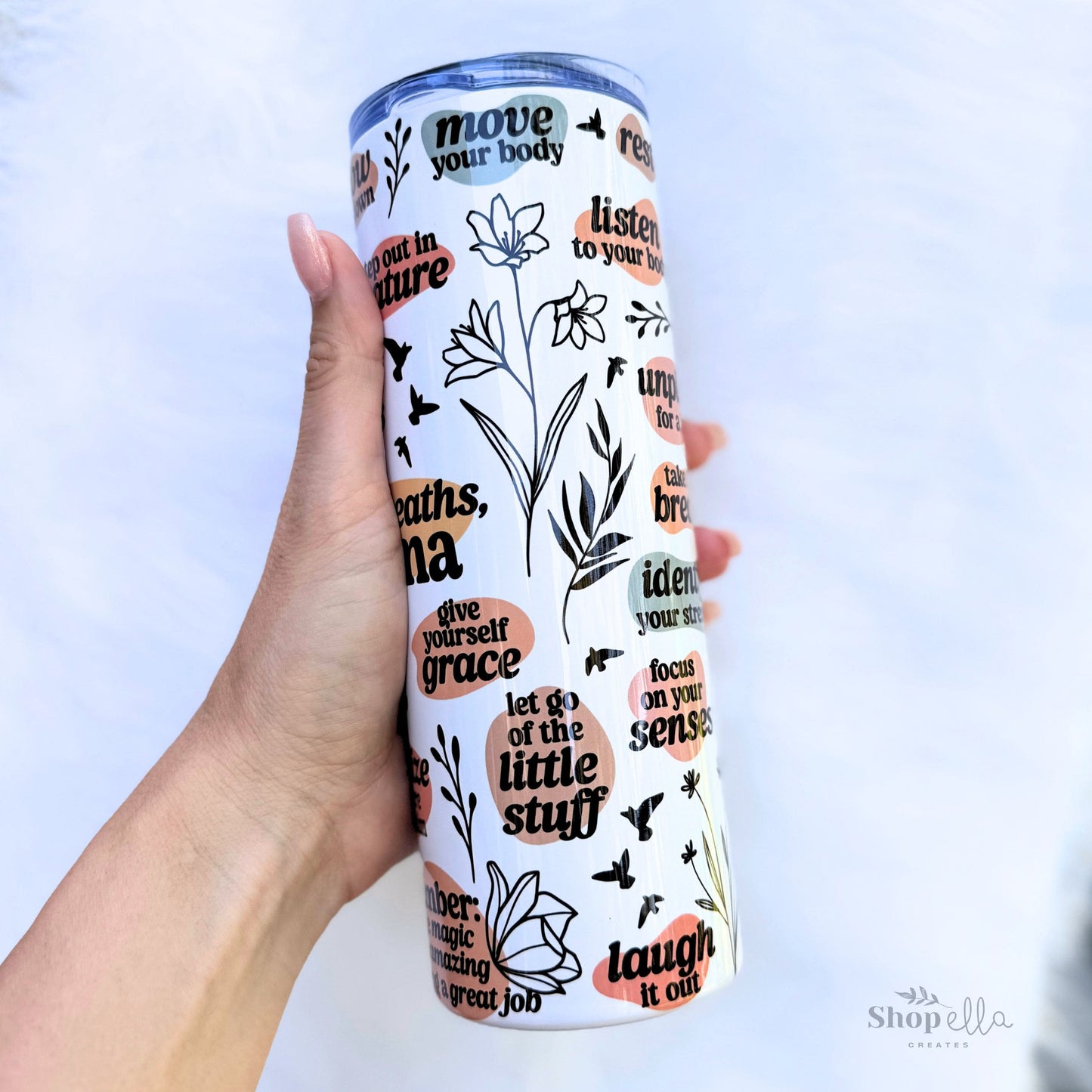 a hand holding a white 20oz skinny tumbler with lid deep breaths mama affirmations