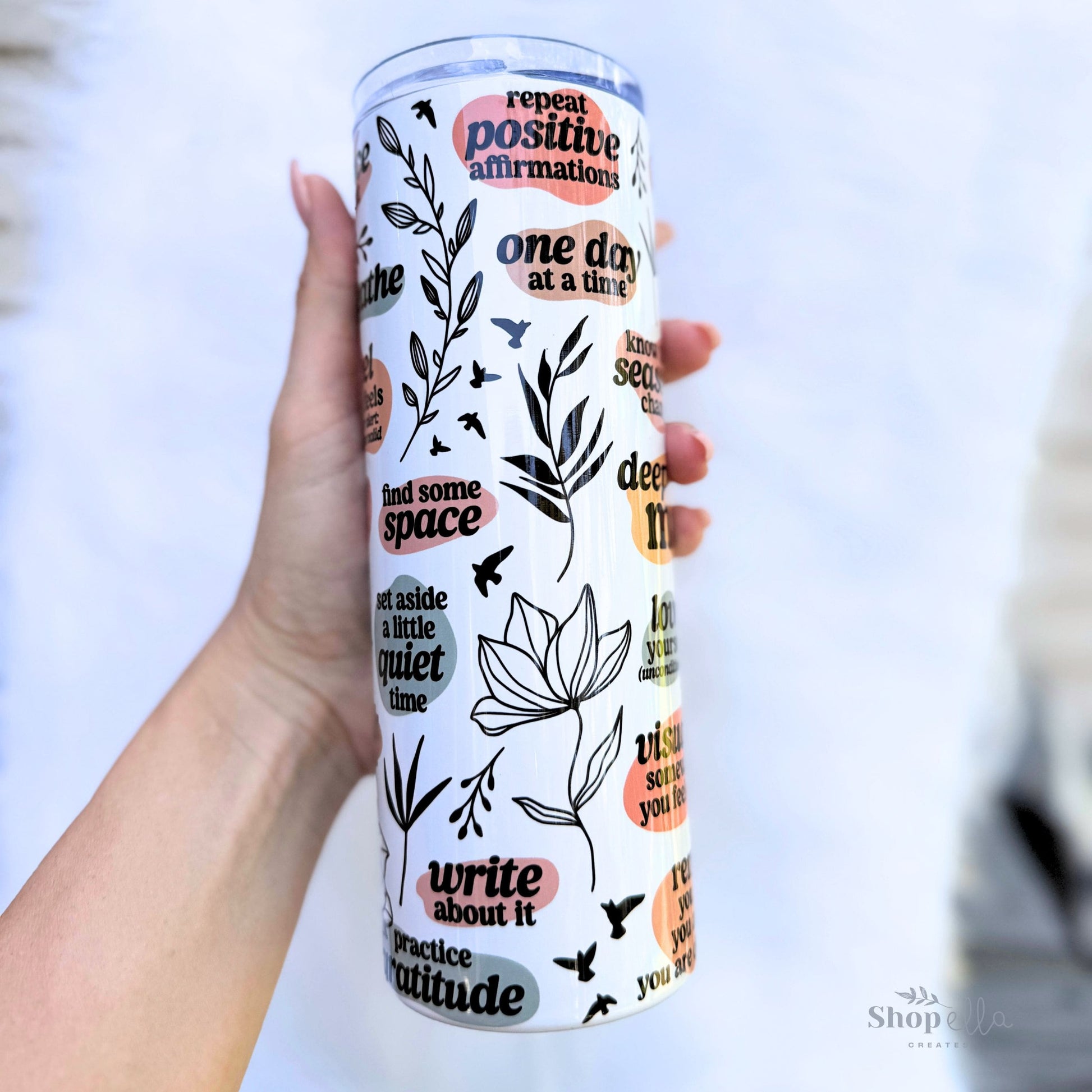 a hand holding a white 20oz skinny tumbler with lid deep breaths mama affirmations