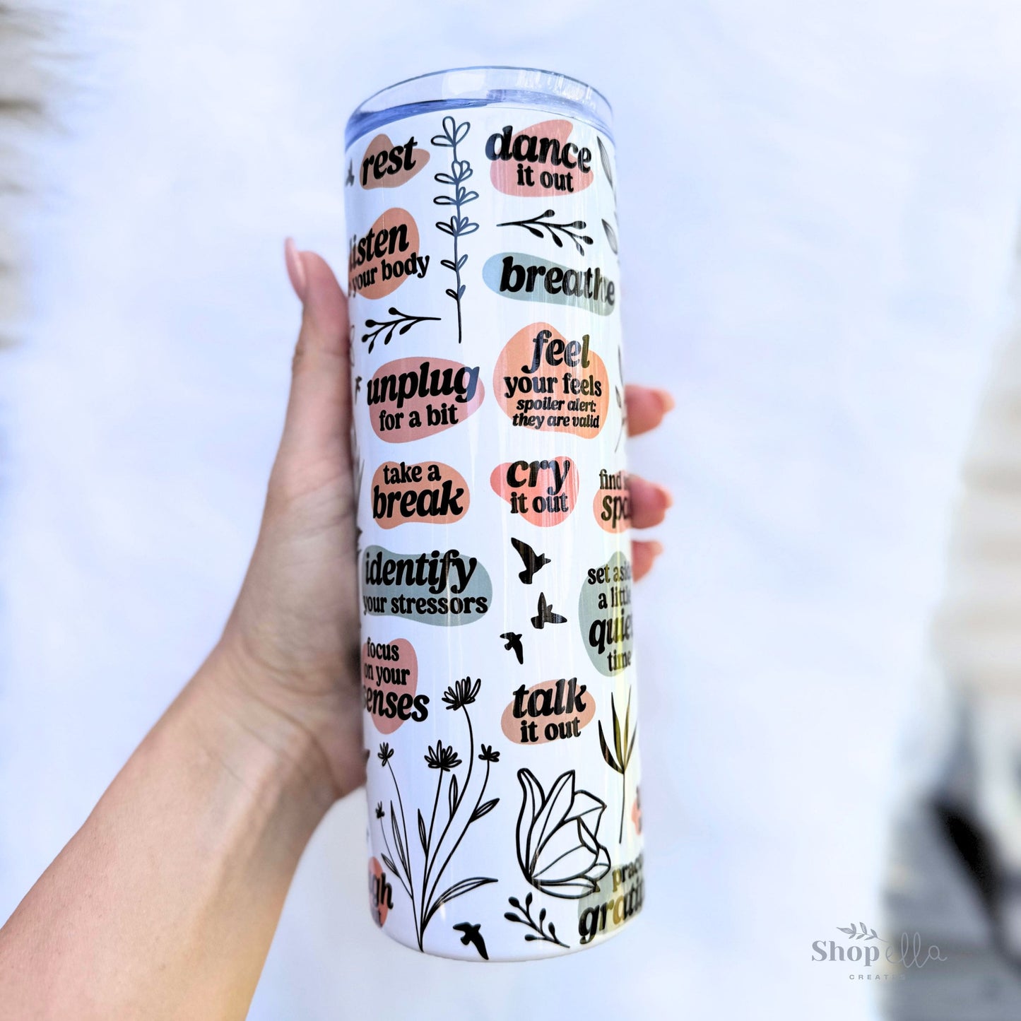 a hand holding a white 20oz skinny tumbler with lid deep breaths mama affirmations